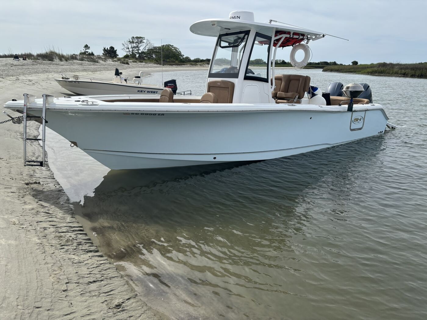 Addi J Charters 26 foot Sea Hunt Ultra 265 on a Charleston beach