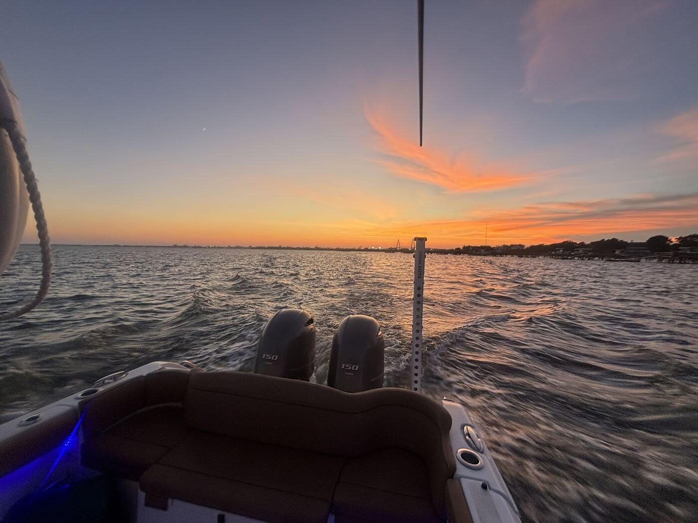 Sunset from the stern of Addi J Charters boat on Charleston Harbor
